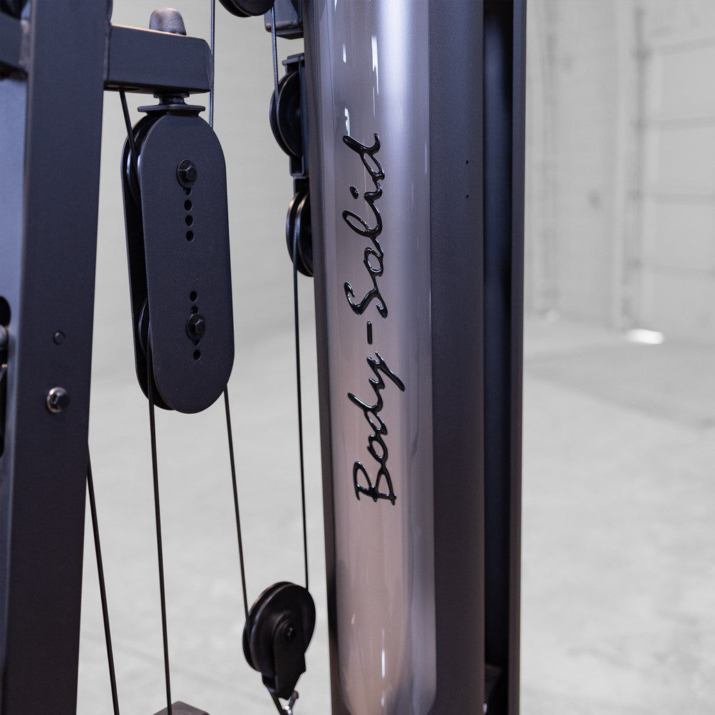 Close up of the Body-Solid weight stack shroud, pulleys and aircraft cable on the G6B home gym