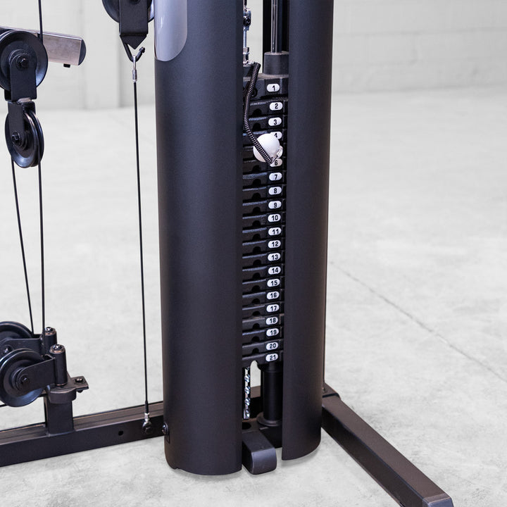 Close up of the Body-Solid G6B selectorized weight stack with numbered plates and the selector pin in place