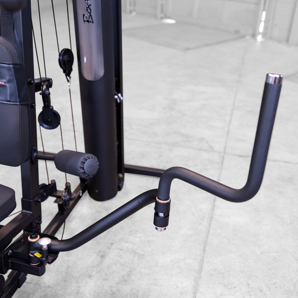 Close up of the Body-Solid G6B seated row handle, leg developer rollers and cable routing