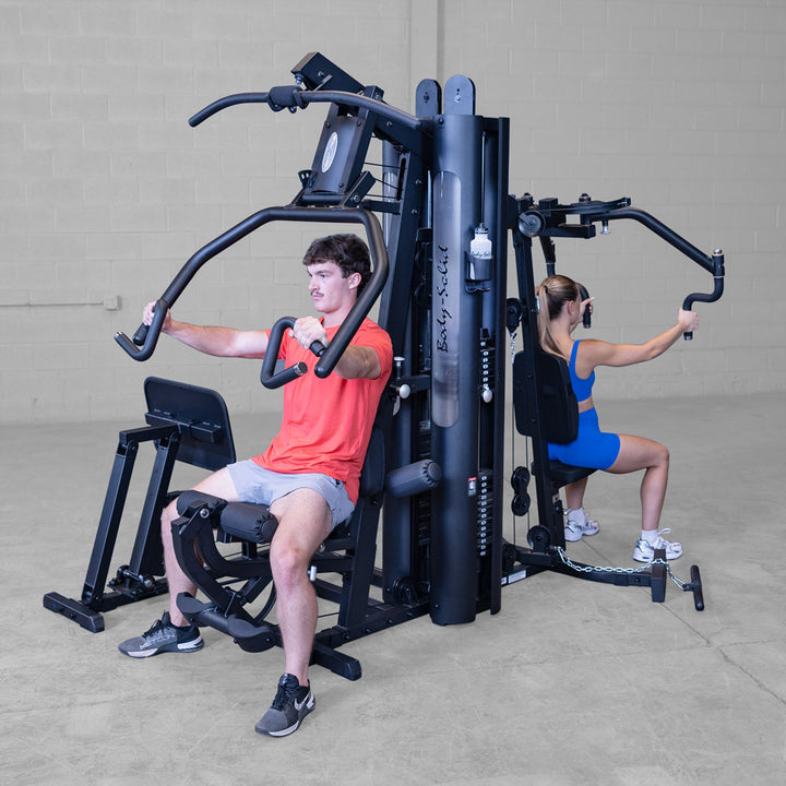 Body-Solid G9B multi-station gym, angled view of the press arm and Perfect Pec station