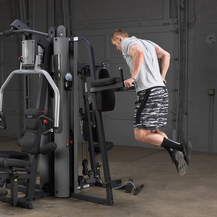 Body-Solid GKR9 vertical knee raise and dip attachment mounted on a G9 multi-station gym