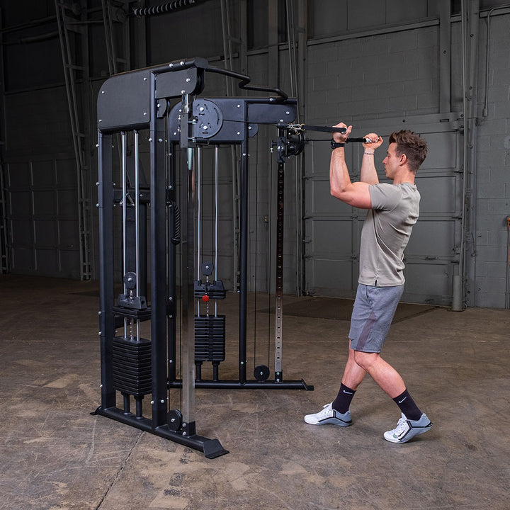 Two-arm cable biceps curl on the Body-Solid GFT100, showing both weight stacks working independently