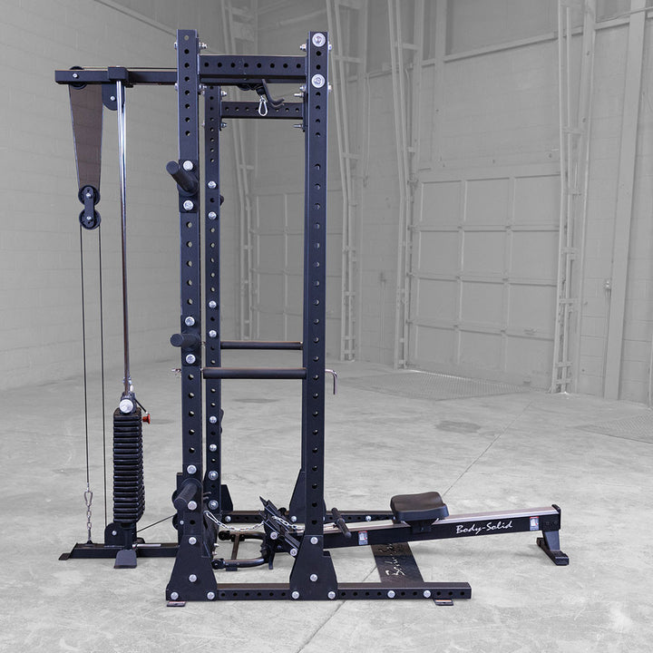 Body-Solid GROW rower attachment at the catch position showing the foot plate and seat carriage