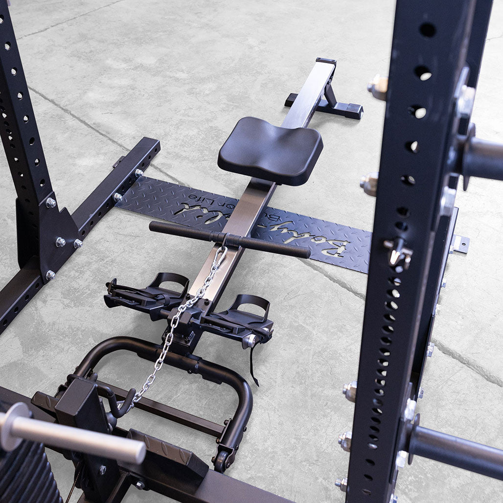 Rowing on the Body-Solid GROW attachment, mid stroke with the low pulley cable under load