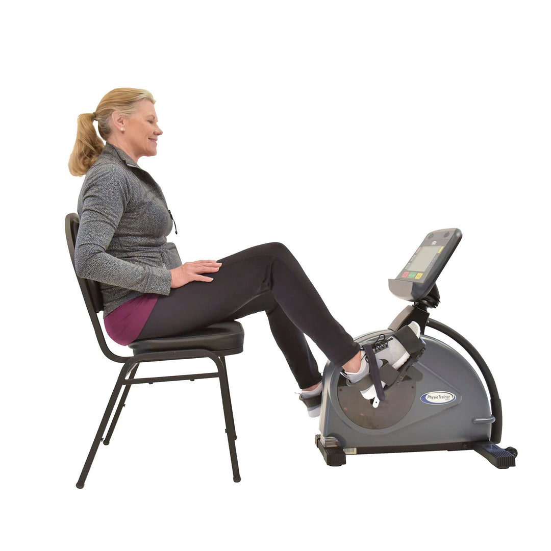 HCI PhysioTrainer PRO Arm Bike PT-PRO with an elderly woman using it as a leg bike