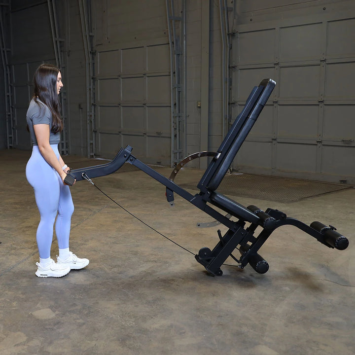 Body-Solid GLEG bench with the leg developer in the lying leg curl position
