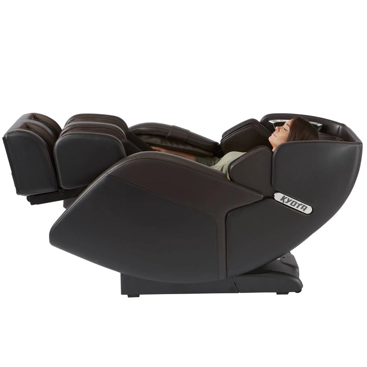 A woman relaxing in the Kenko 4D Full Body Massage Chair M673 brown variant in a reclined position