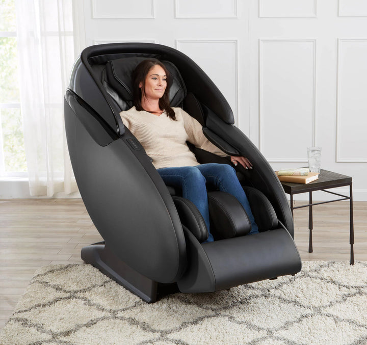 a woman relaxing in the Kaizen Full Body Massage Chair M680 black variant 