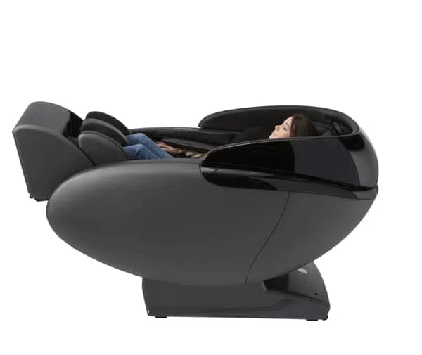 A woman relaxing in the Kaizen Full Body Massage Chair M680 black variant in an reclined position