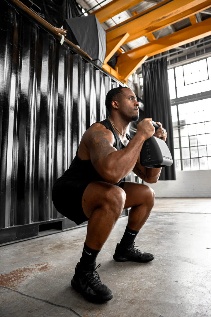 man adjustable kettlebell squat workout