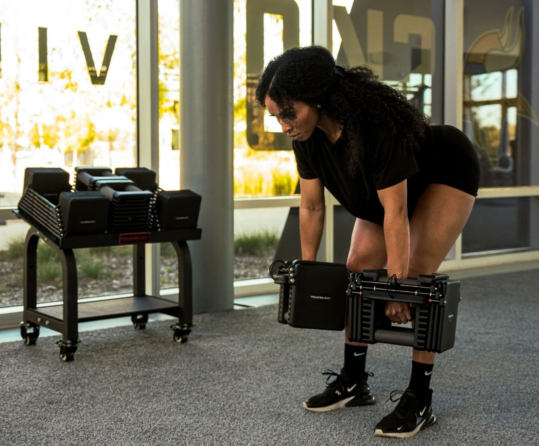 Commercial Pro 125 dumbbell seen end on, showing the stainless steel hardware and stacked plates