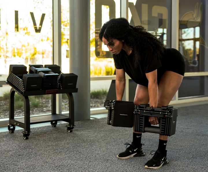 Commercial Pro 125 dumbbell seen end on, showing the stainless steel hardware and stacked plates