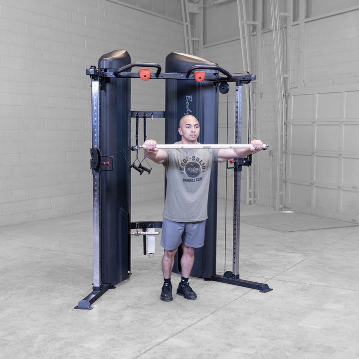 Body-Solid S2FTX functional trainer in use, standing cable press