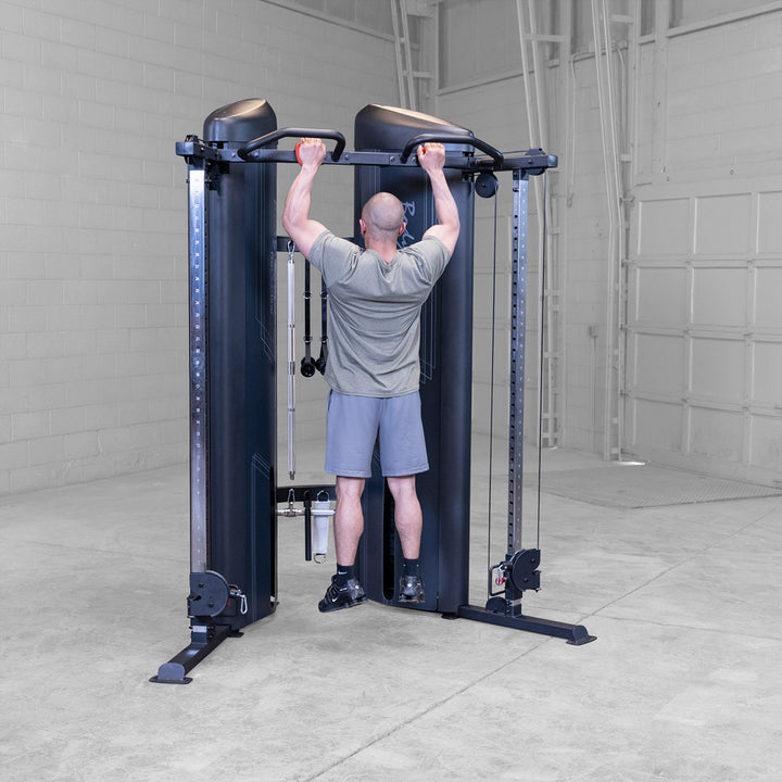 Body-Solid S2FTX functional trainer, close view of a pulley carriage and adjustment pin