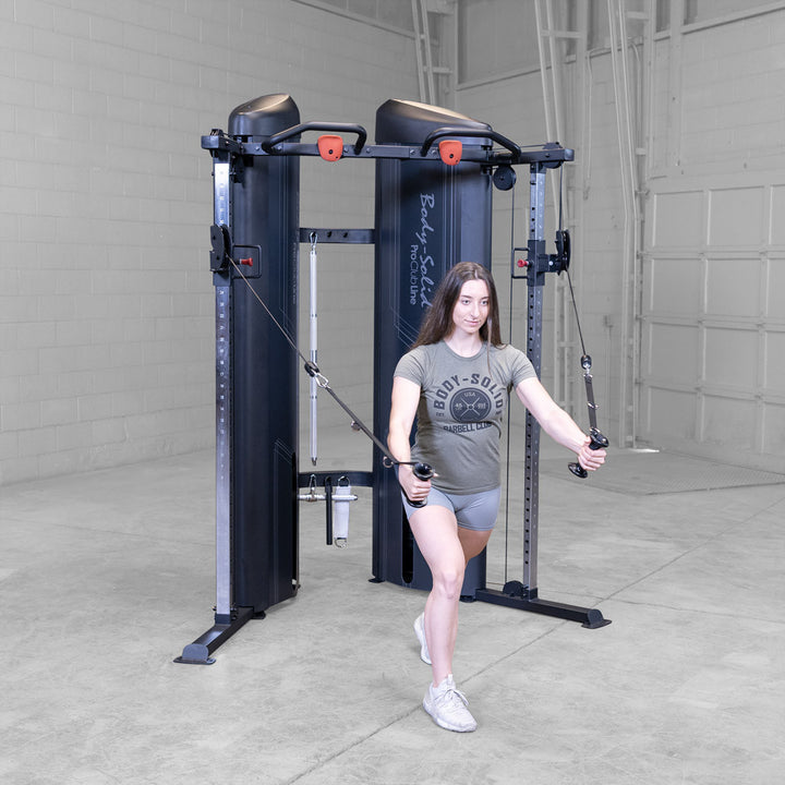 Body-Solid S2FTX functional trainer in use, cable exercise from a low pulley position