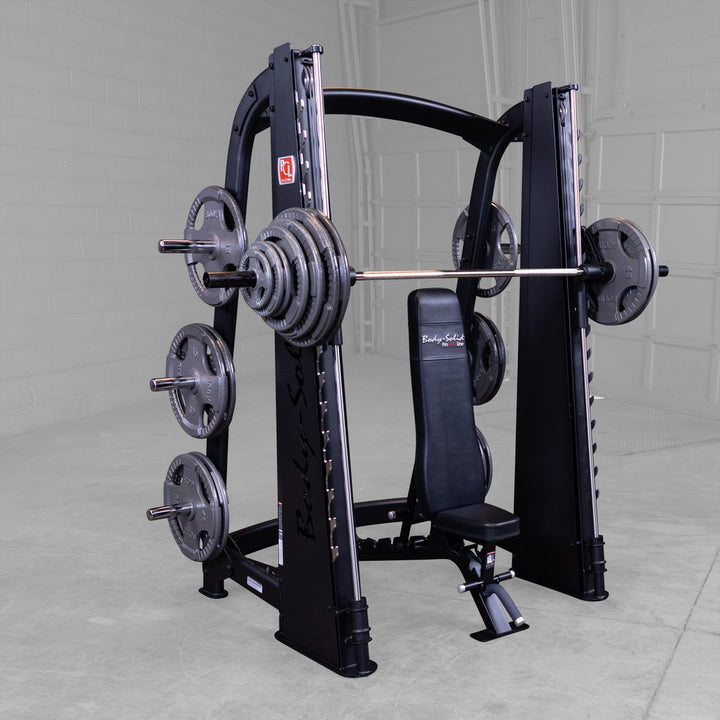 Body-Solid SCB1000B Smith machine shown with an adjustable bench positioned under the bar