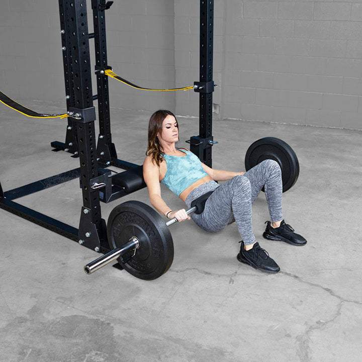 Body-Solid SPRHT hip thruster attachment shown in a power rack