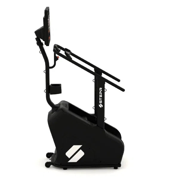 The STEPR+ Stair Climber by STEPR is a black stepper with handlebars and a digital display. Its compact design has wheels for easy movement and a sturdy base, perfect for indoor cardio in home gyms.