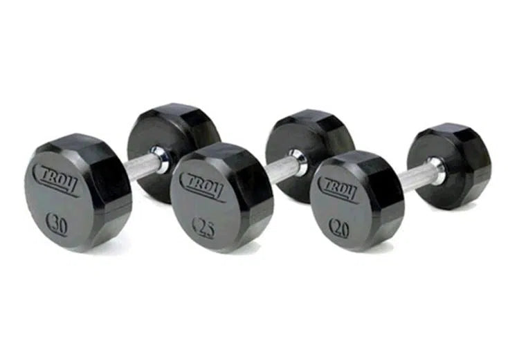 Four Troy dumbbells from the 5-75 lb Rubber Commercial Set are arranged in ascending order—30, 25, and 20 pounds. These black hexagonal weights with sleek silver handles are ideal for versatile strength training.