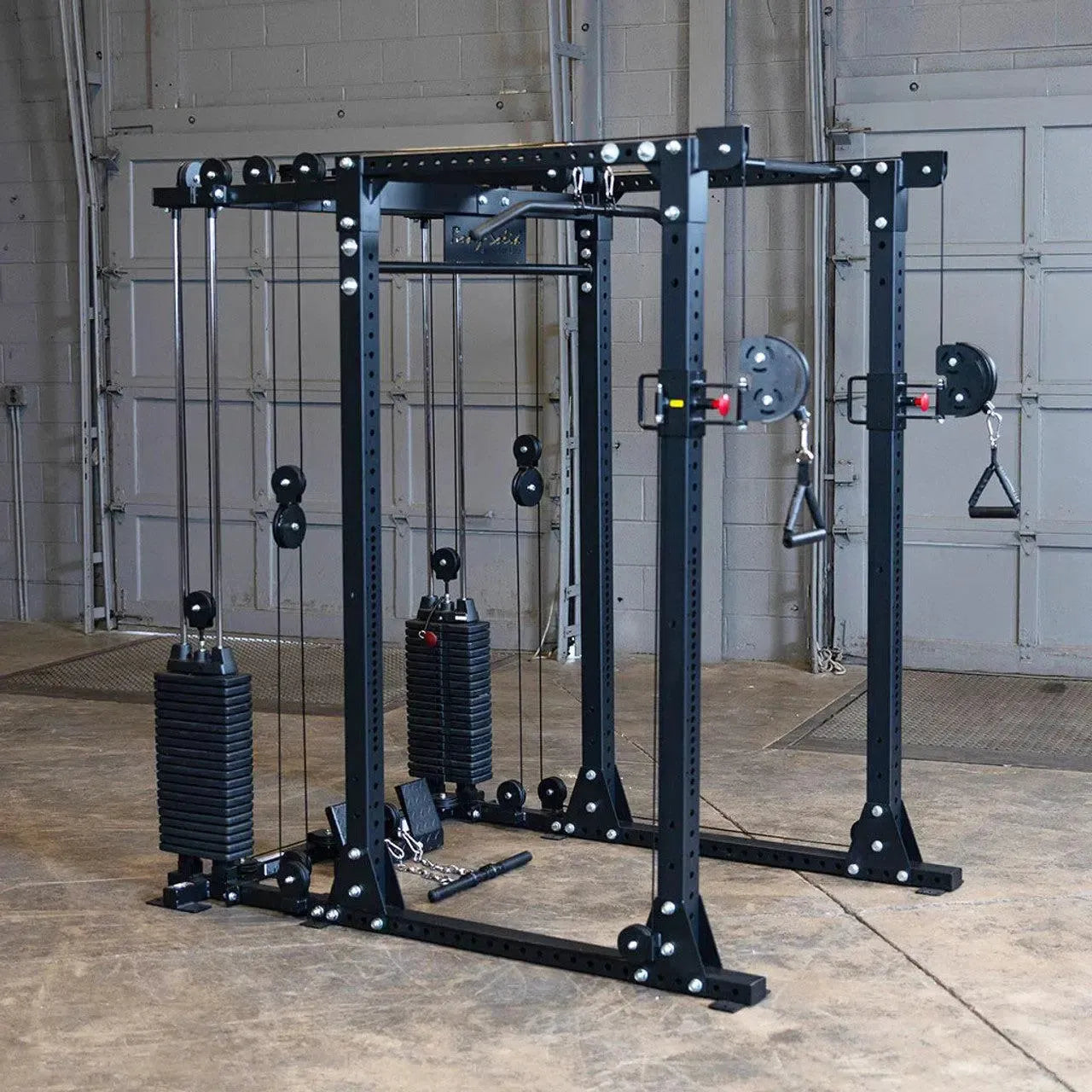Body-Solid GPR400 power rack fitted with the GPRFTS cable crossover attachment and dual 210 lb. weight stacks