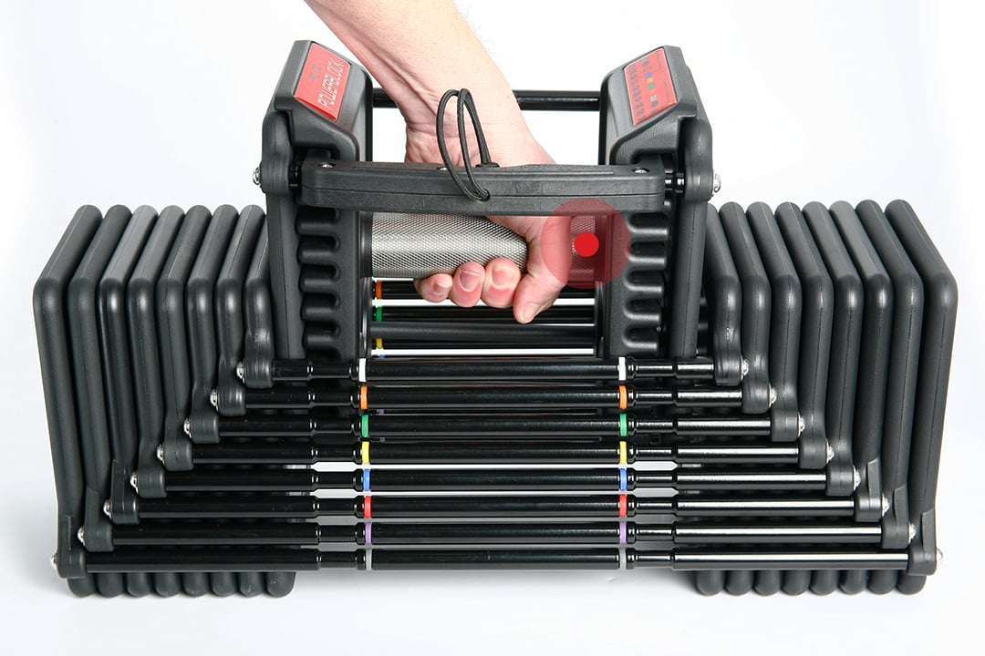 Lifting a Commercial Pro 100 dumbbell out of the weight stack at a 15 lb setting