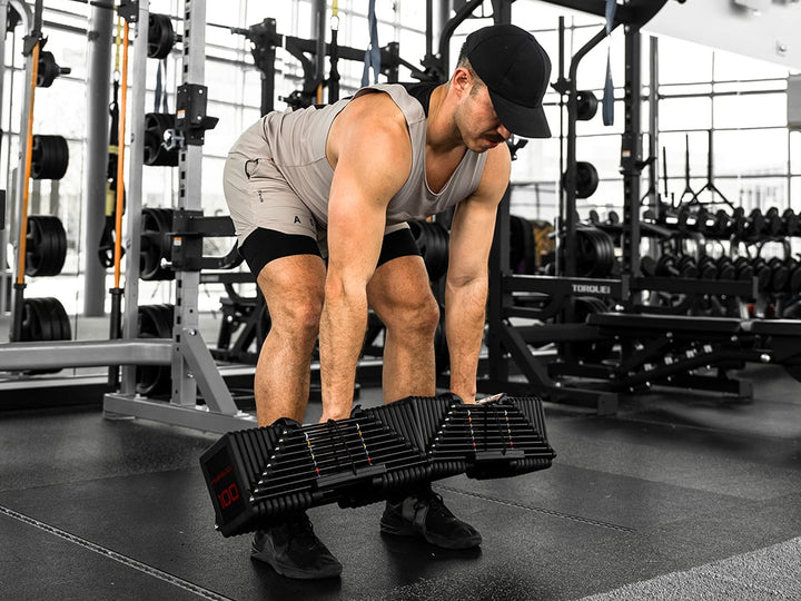 Dumbbell deadlift performed with a pair of PowerBlock Commercial Pro 100 adjustable dumbbells