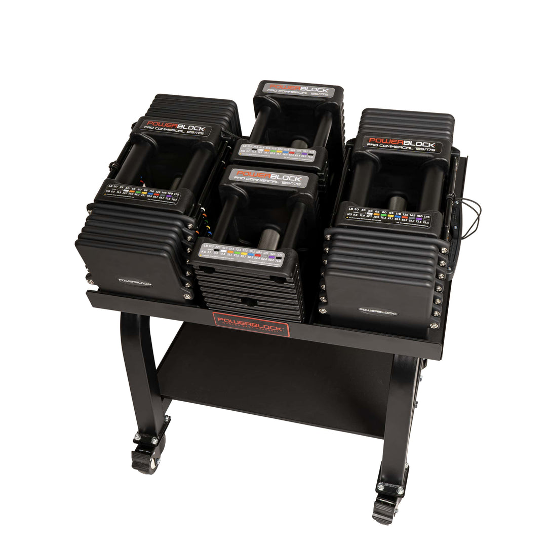 PowerBlock Commercial Pro 125 adjustable dumbbell, showing the black urethane coated weight plates and the selector pin