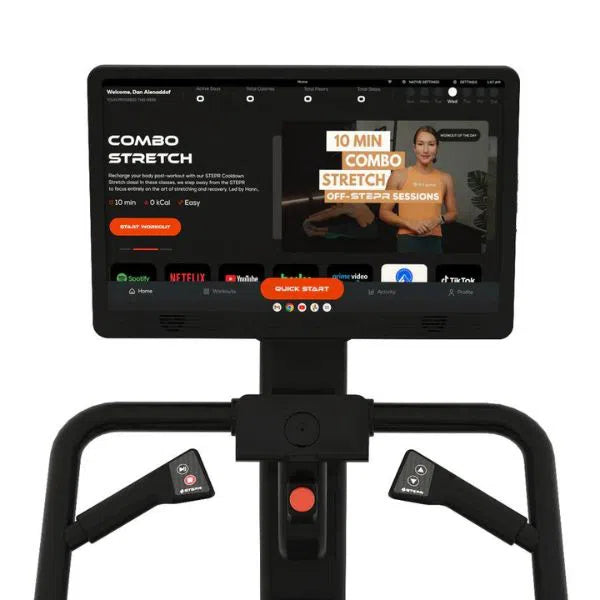 Experience the revolutionary STEPR PRO+ Commercial Stair Climber by STEPR, featuring an HD touchscreen with 10 Min Combo Stretch videos. Enjoy app icons like Spotify, Netflix, YouTube, and TikTok on its sleek design with two interactive hand grip controls.