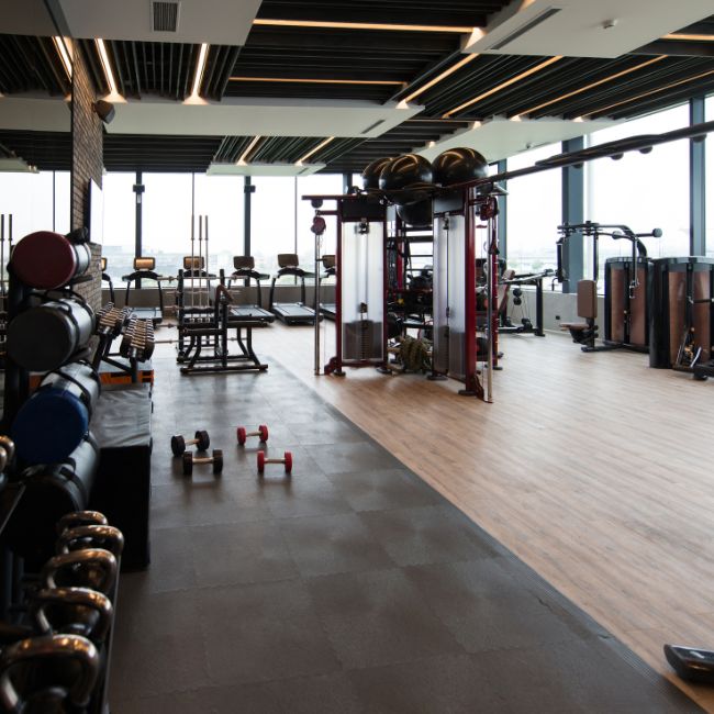 cooperate office fitness center with gym equipment