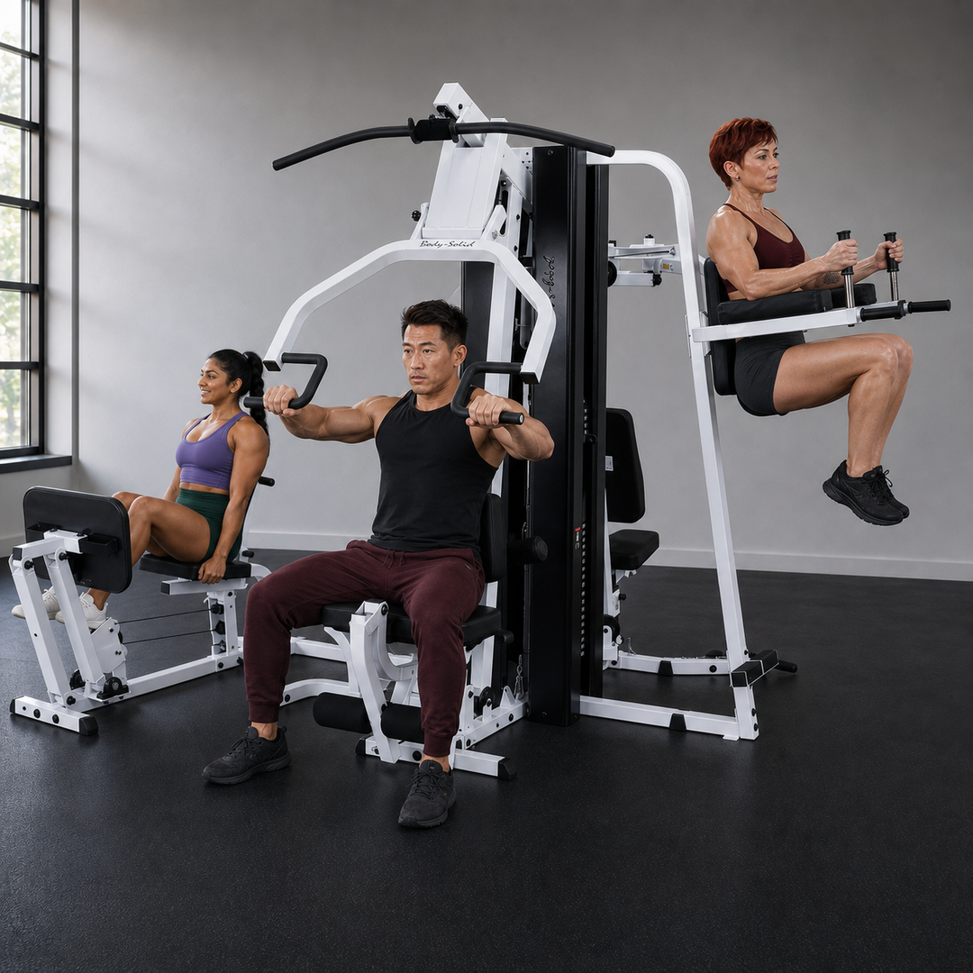 Three fit models training simultaneously on the Body-Solid EXM3000LPS multi-station home gym