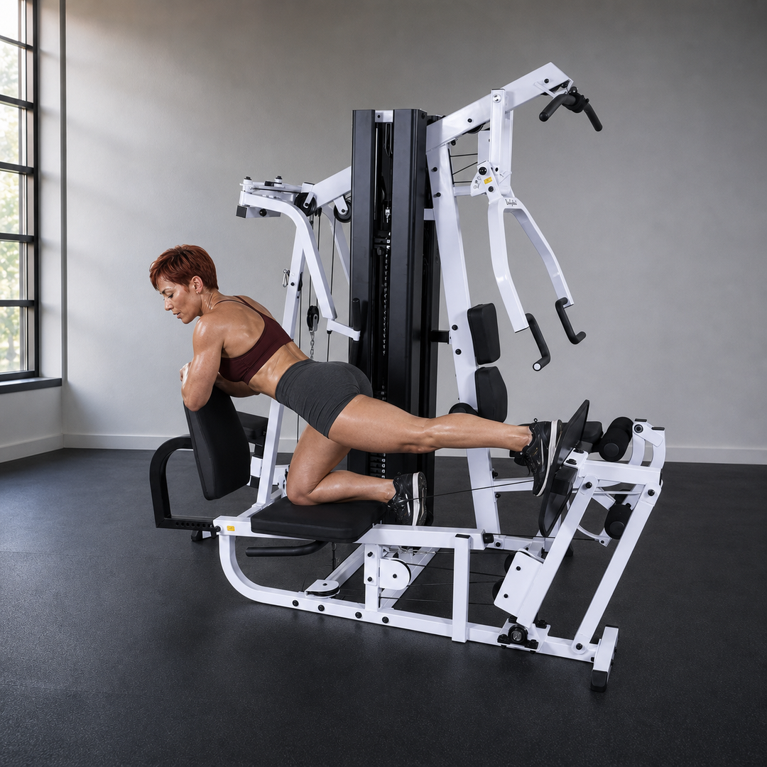 Fit model performing a single-leg kickback on the Body-Solid EXM3000LPS low pulley