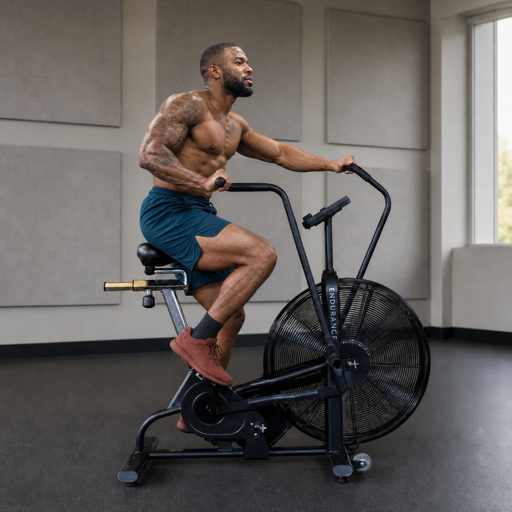 Body-Solid Endurance FB300B fan bike with athlete using the dual-action handlebars