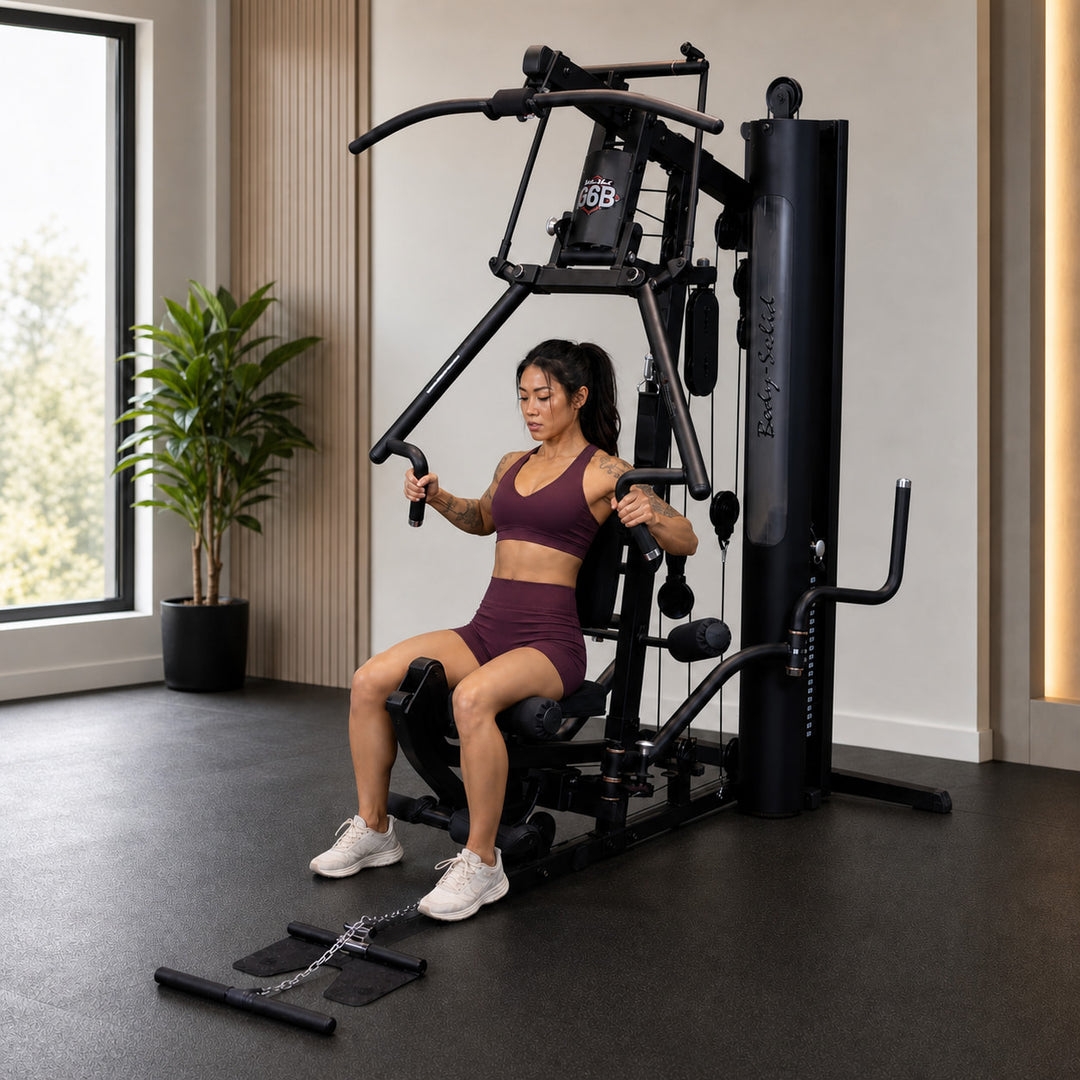 Fit model performing a chest press on the Body-Solid G6B Bi-Angular press arm