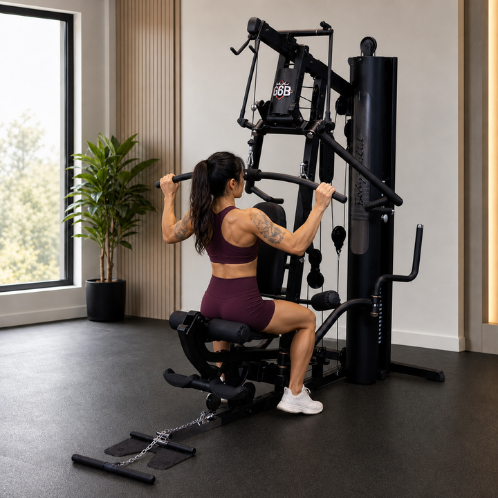 Fit model performing a wide-grip lat pulldown on the Body-Solid G6B high pulley