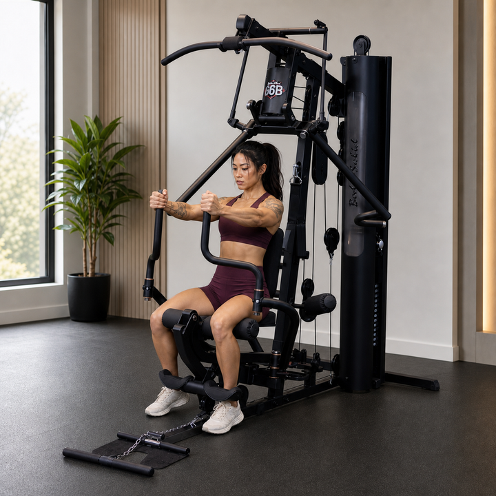Fit model performing a pec fly on the Body-Solid G6B Perfect Pec station
