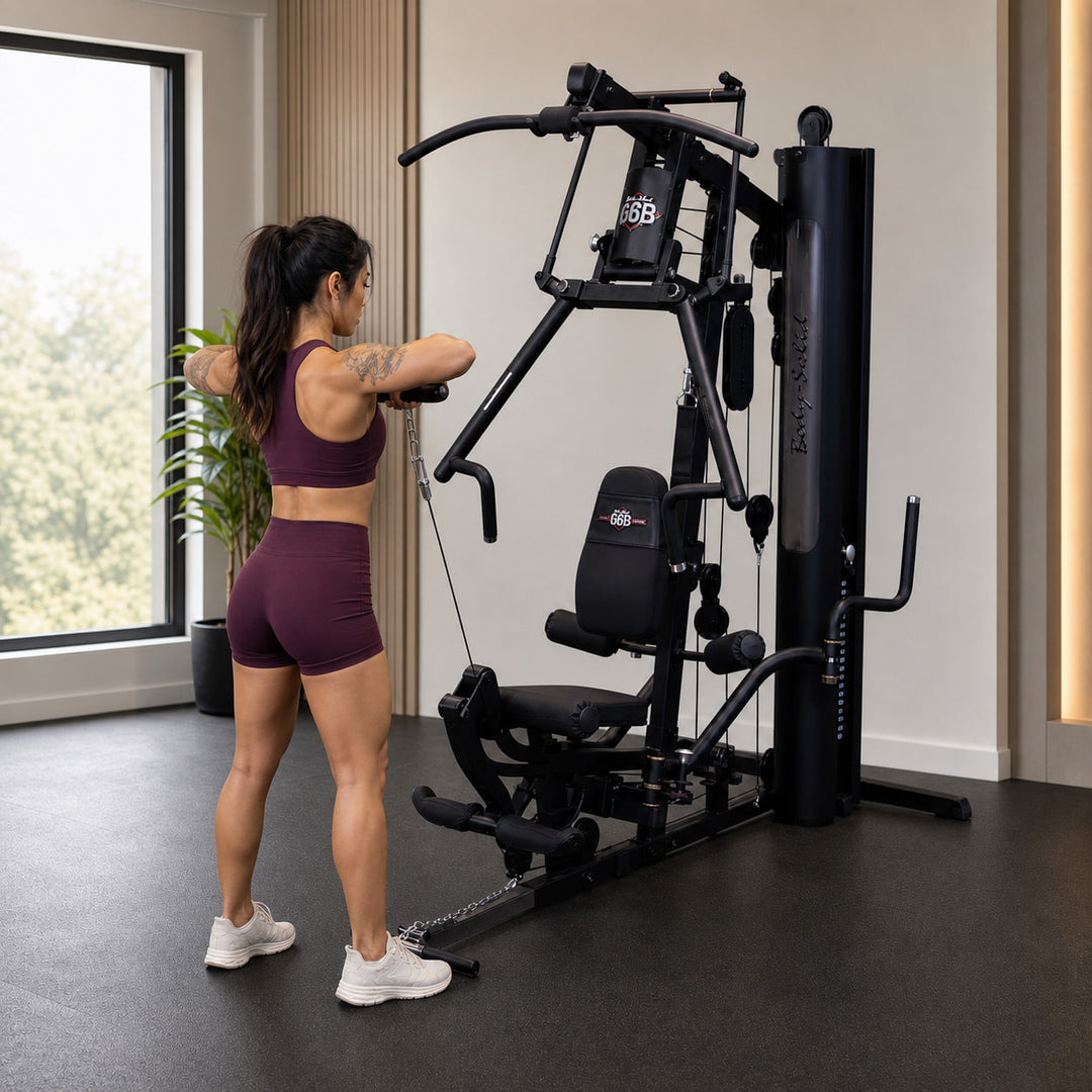 Fit model performing a one-arm cable raise on the Body-Solid G6B low pulley