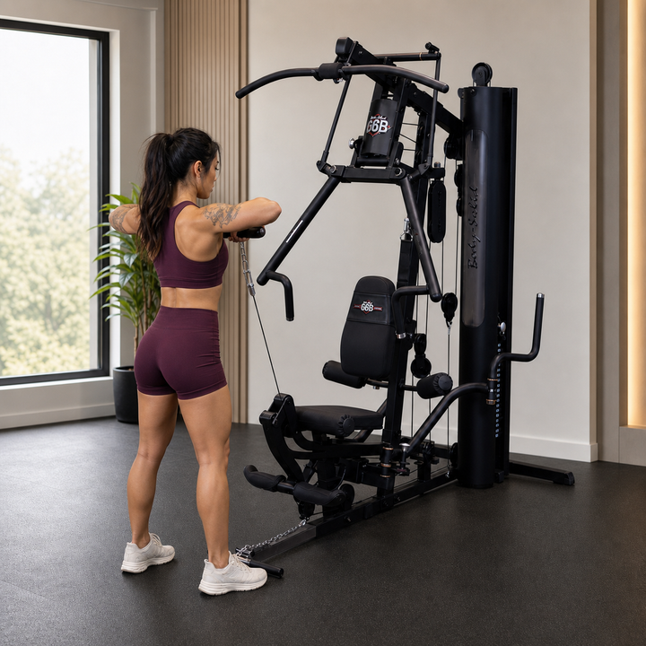 Fit model performing a one-arm cable raise on the Body-Solid G6B low pulley