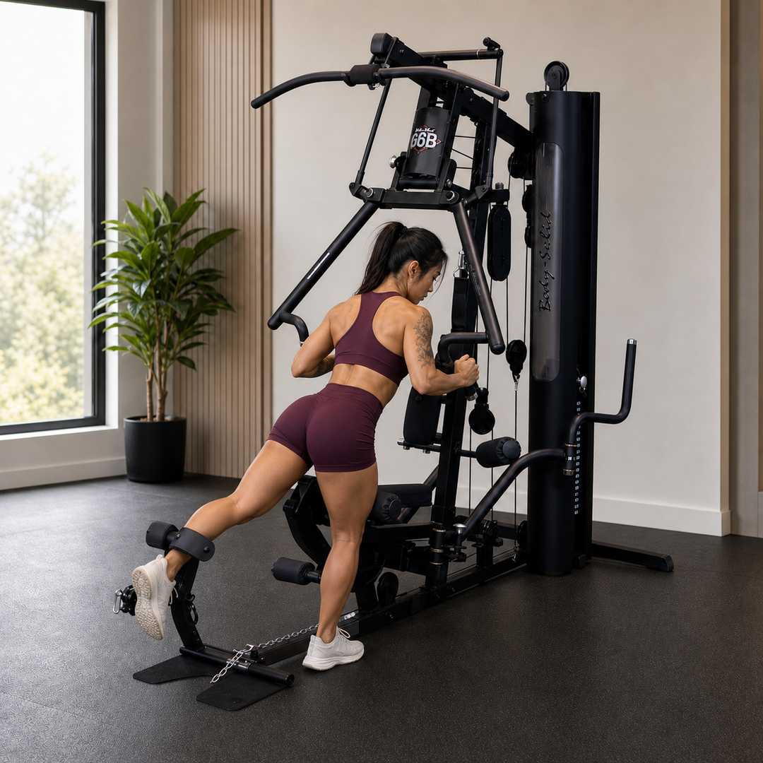 Fit model performing a standing back hyperextension using the Body-Solid G6B press arm