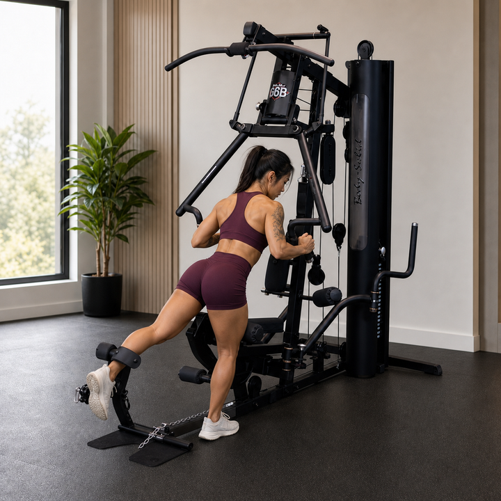Fit model performing a standing back hyperextension using the Body-Solid G6B press arm