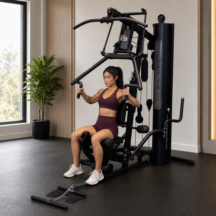 Fit model performing a shoulder press on the Body-Solid G6B Bi-Angular press arm