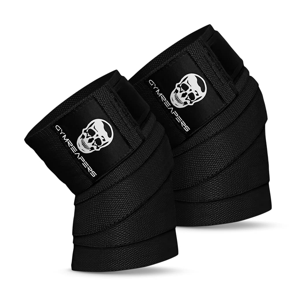 A pair of black wrist wraps with a white skull logo and the word Gymreapers printed on the label.
