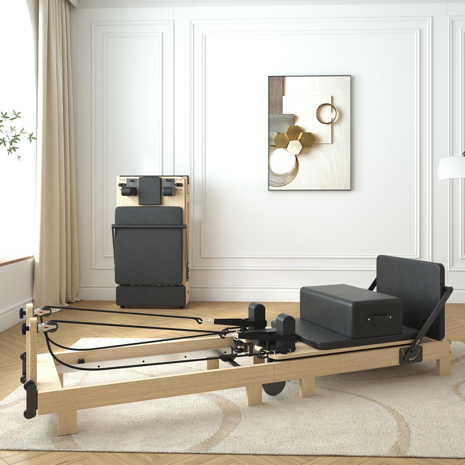 A modern living room with a wooden Pilates reformer and black padding in the center, another reformer stored upright against the wall, and a decorative mirror hanging above it.