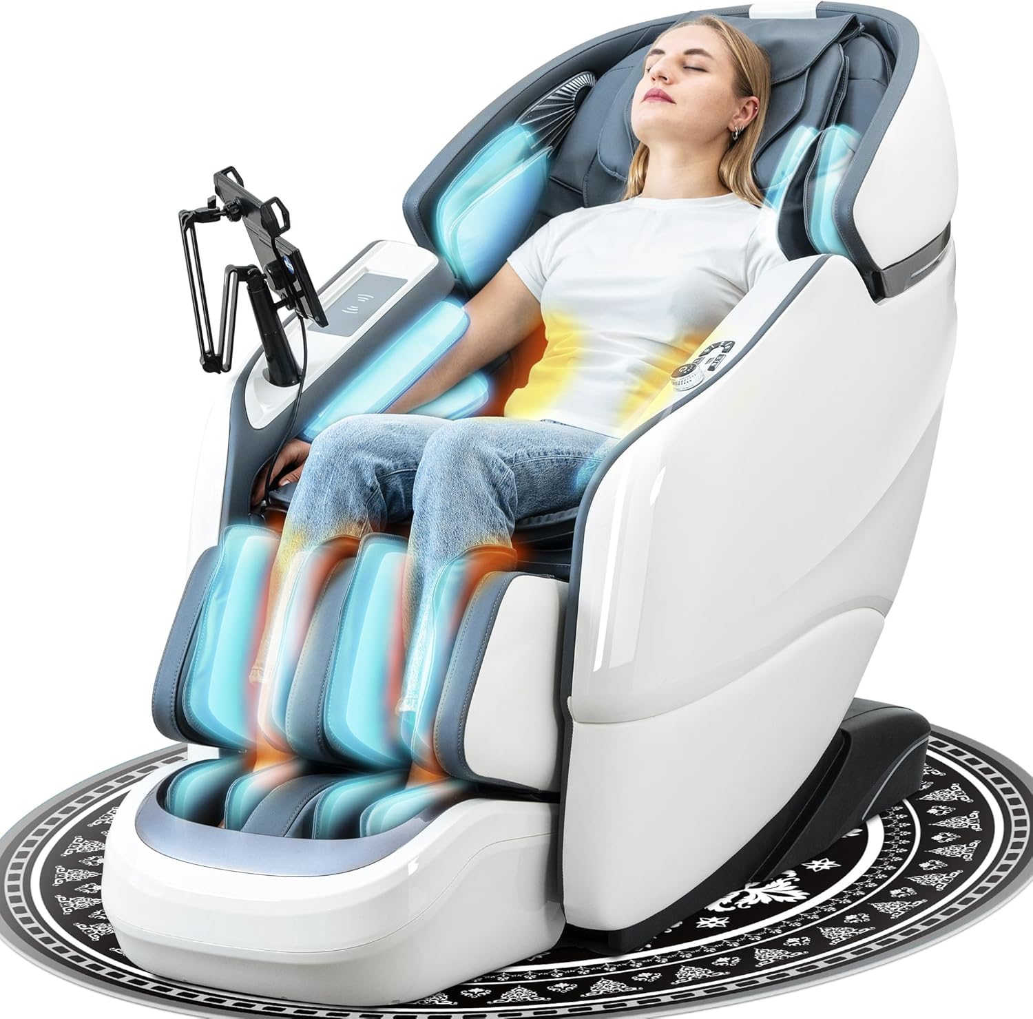 A woman relaxes in a modern, white massage chair with blue light accents and an attached control panel, enjoying a full-body massage. She appears calm with eyes closed, seated on a patterned rug.