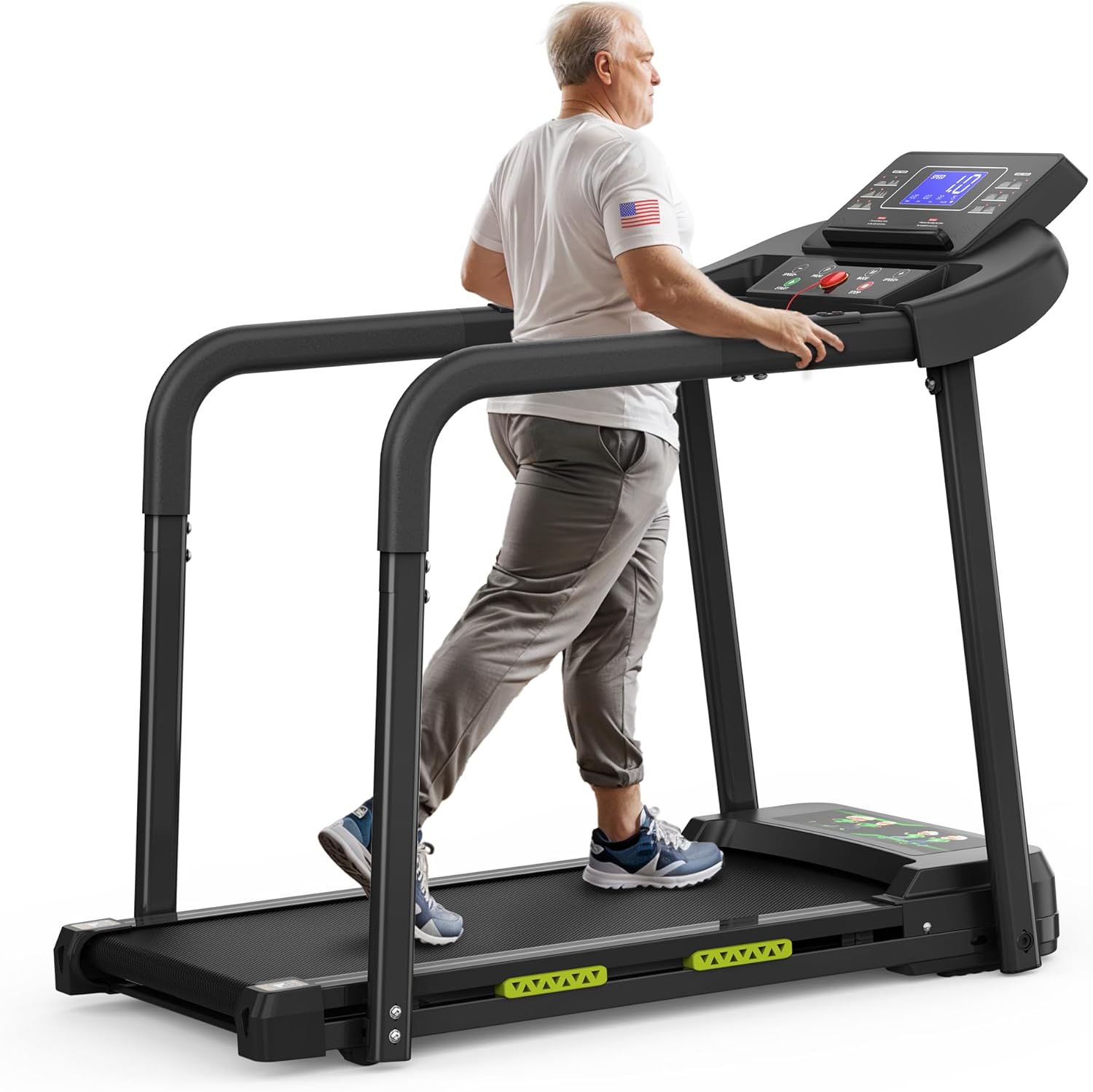 An older adult wearing a white t-shirt and gray pants walks on a black treadmill with an electronic display, exercising indoors.