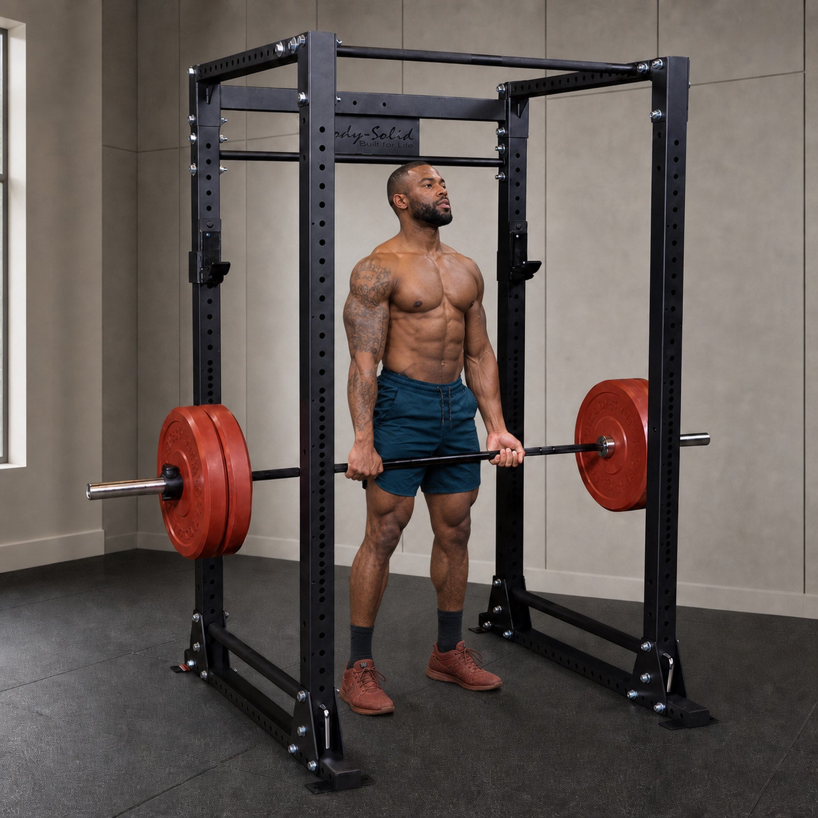 Body-Solid GPR400 power rack with athlete performing a rack pull in a premium studio