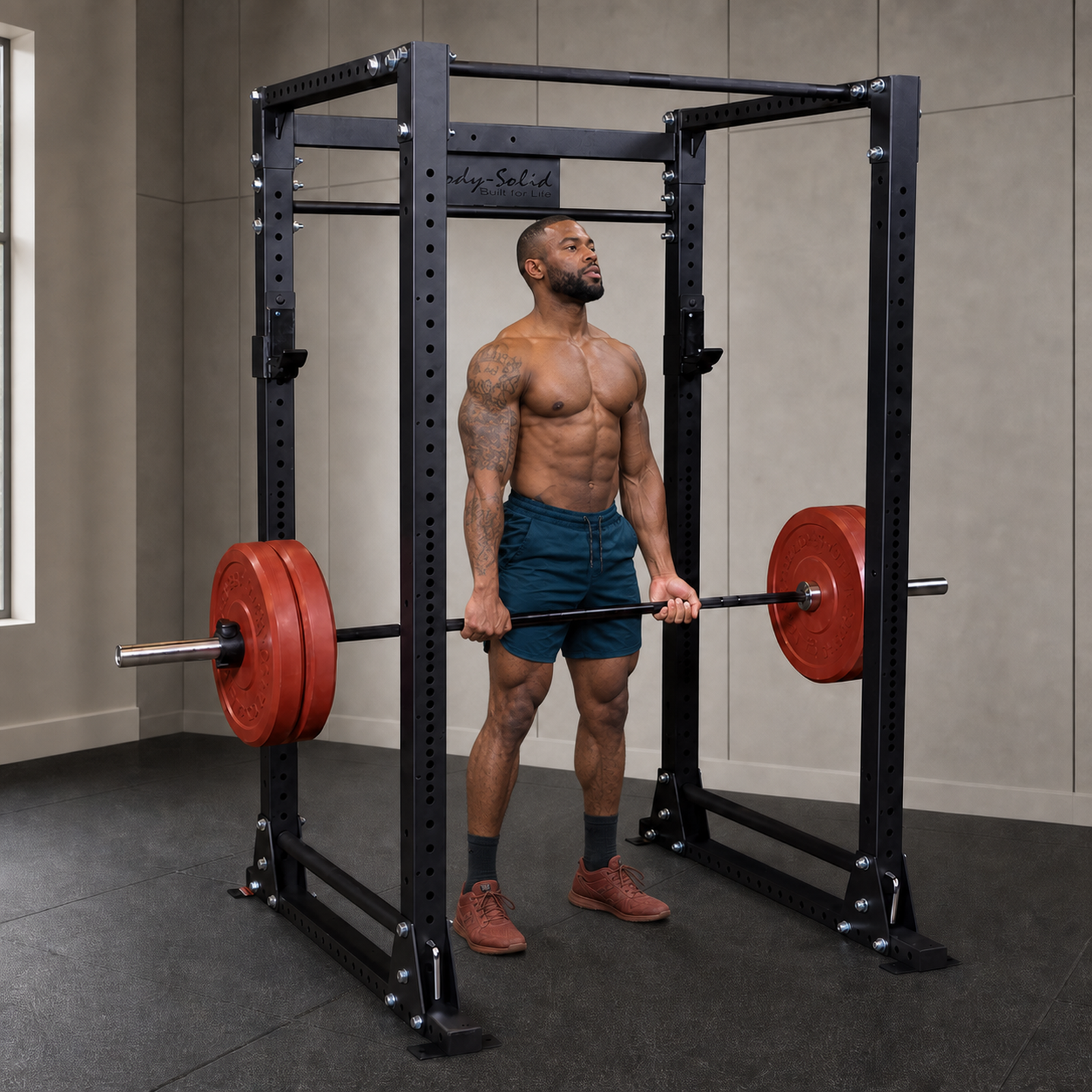 Body-Solid GPR400 power rack with athlete performing a rack pull in a premium studio
