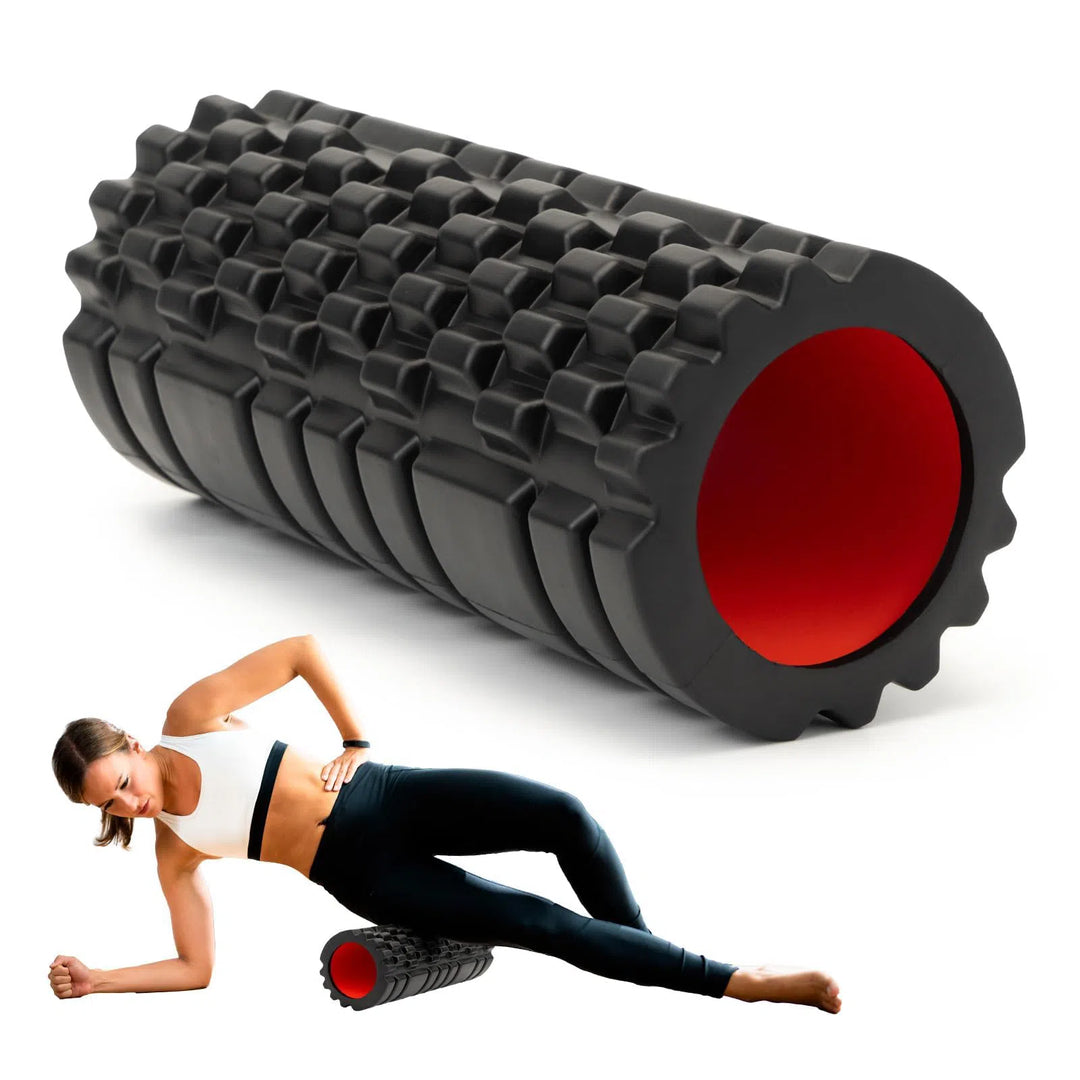 A woman in athletic wear showcases the Krightlink Deep Tissue Foam Roller, featuring a textured surface, as she uses the black roller with a red core on her side.