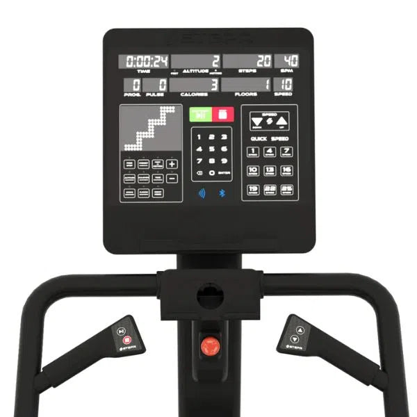 Close-up of a black STEPR PRO Classic Stair Climber display panel showing time, altitude, steps, floors, calories, and speed. Below are handle grips with heart rate sensors and an emergency stop button—ideal for high-intensity training sessions.