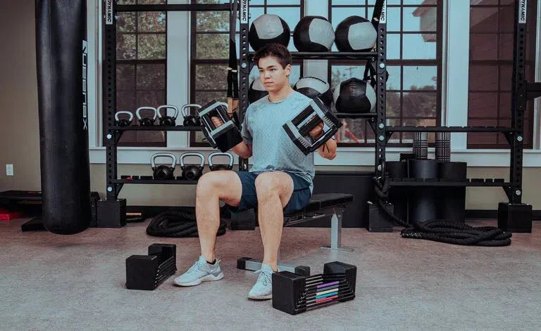 man workout on bench powerblock 90 lb adjustable dumbbell elite EXP90