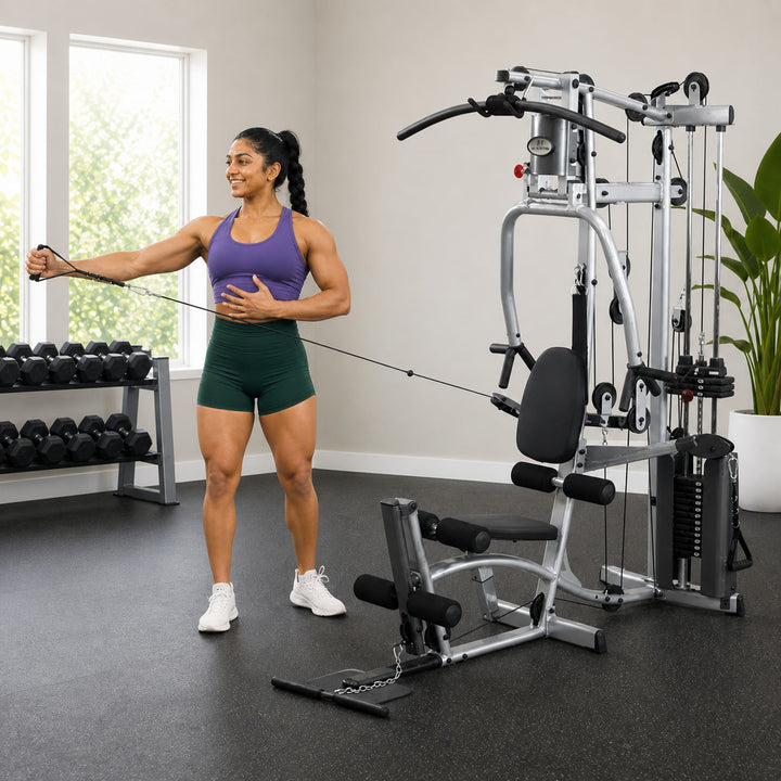 Fit model performing a standing cable shoulder exercise on the Powerline P2X functional pulley